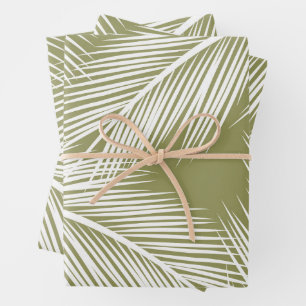 White palm leaves on green color background wrapping paper sheets