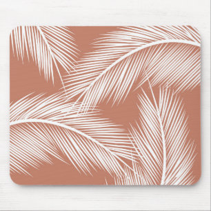 White palm leaves on terracotta color background mouse pad