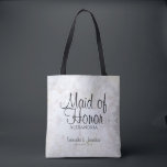 White Peonies & Hearts Wedding Maid of Honor Tote Bag<br><div class="desc">This beautiful tote bag is perfect for thanking your Maid of Honor. It features black text over a background of reflecting white peony flowers and hearts. The text is fully customizable and reads: Maid of Honor, with a place for her name, the couple's names and wedding date. Perfect for filling...</div>