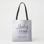 White Peonies & Hearts Wedding Maid of Honor Tote Bag<br><div class="desc">This beautiful tote bag is perfect for thanking your Maid of Honor. It features black text over a background of reflecting white peony flowers and hearts. The text is fully customizable and reads: Maid of Honor, with a place for her name, the couple's names and wedding date. Perfect for filling...</div>