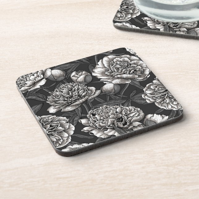White peony flowers on dark gray beverage coaster (Left Side)
