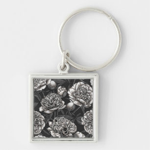 White peony flowers on dark gray keychain
