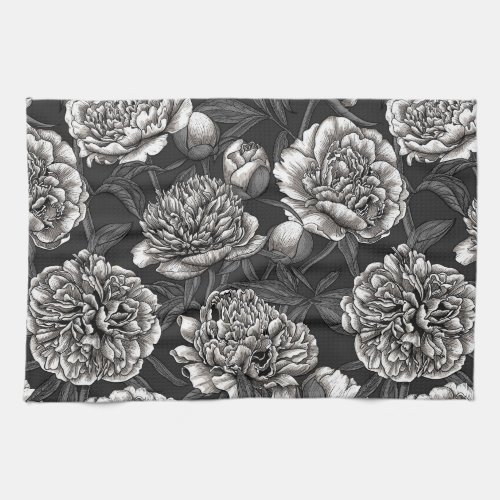 White peony flowers on dark gray kitchen towel