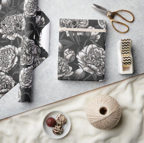 White peony flowers on dark gray wrapping paper