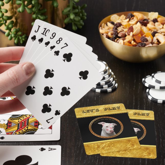 White pitbull with red kisses all over his face. poker cards (In Situ)
