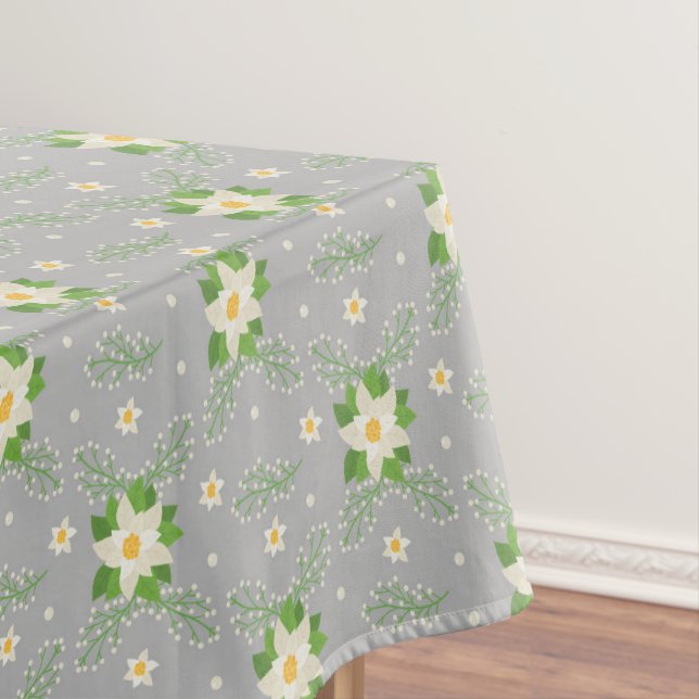 White Poinsettias Green Leaves Christmas on Gray Tablecloth (In Situ)