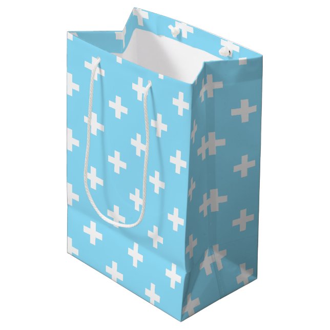 White polka crosses on baby blue medium gift bag (Front Angled)