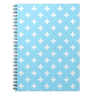 White polka crosses on baby blue notebook