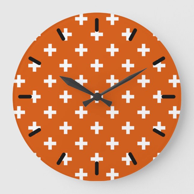 White polka crosses on burnt orange large clock (Front)
