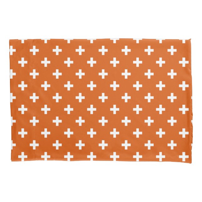 White polka crosses on burnt orange pillow case (Front)