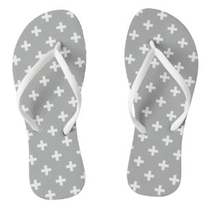 White polka crosses on gray flip flops