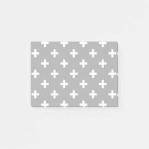 White polka crosses on gray post-it notes