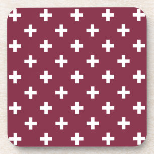 White polka crosses on mulberry beverage coaster