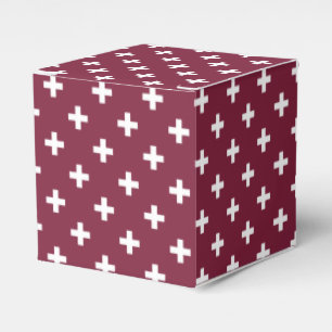 White polka crosses on mulberry favor boxes