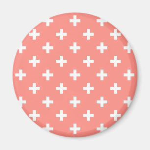 White polka crosses on peach magnet