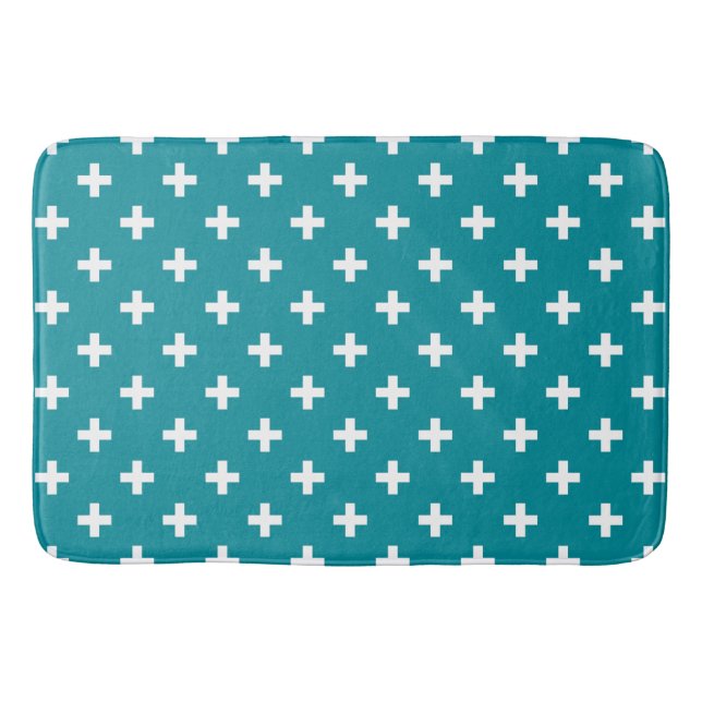 White polka crosses on teal bath mat (Front)