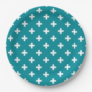 White polka crosses on teal paper plates