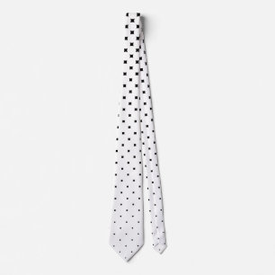 White polka dot graduation and black background neck tie