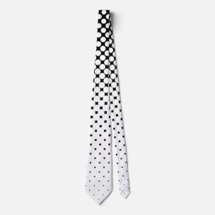 White polka dot graduation and black background neck tie