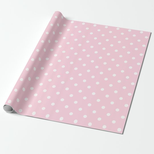 white polka dots on light pink wrapping paper