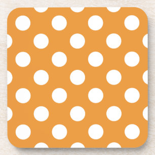 White polka dots on amber beverage coaster
