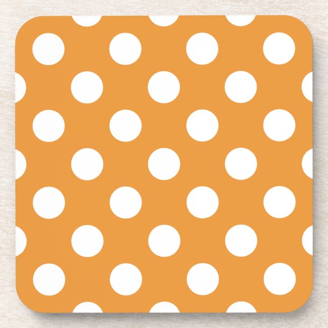 White polka dots on amber beverage coaster (Front)