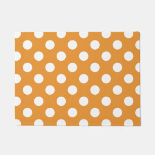 White polka dots on amber doormat