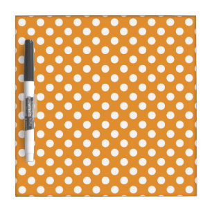 White polka dots on amber dry erase board