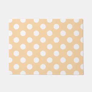 White polka dots on beige doormat