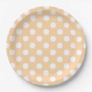White polka dots on beige paper plates