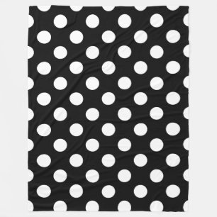 White polka dots on black fleece blanket