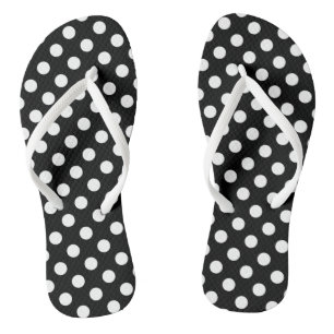 White polka dots on black flip flops