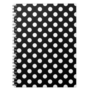 White polka dots on black notebook