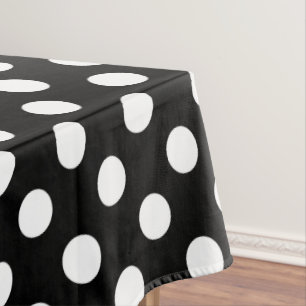 White polka dots on black tablecloth