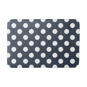 White polka dots on blue-gray bath mat