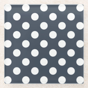 White polka dots on blue-gray glass coaster