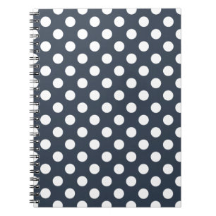 White polka dots on blue-gray notebook