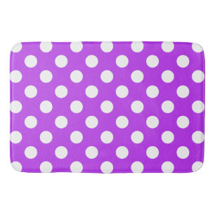 White polka dots on bright purple bathroom mat