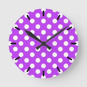 White polka dots on bright purple round clock