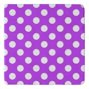 White polka dots on bright purple trivet