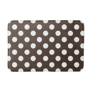 White polka dots on brown bathroom mat