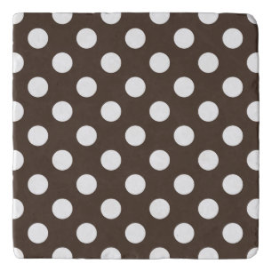 White polka dots on brown trivet