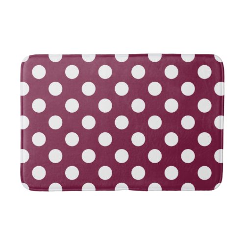 White polka dots on burgundy bathroom mat