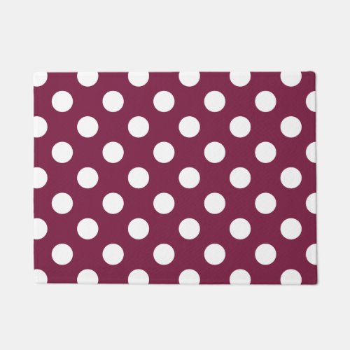 White polka dots on burgundy doormat