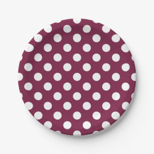 White polka dots on burgundy paper plates