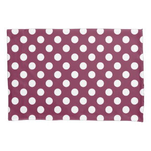 White polka dots on burgundy pillowcase