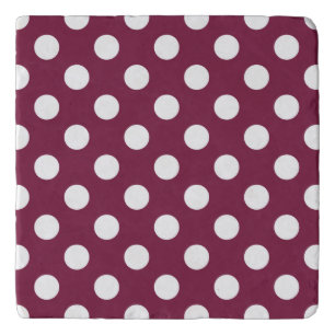 White polka dots on burgundy trivet