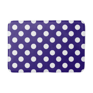 White polka dots on dark blue bathroom mat