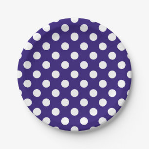 White polka dots on dark blue paper plates