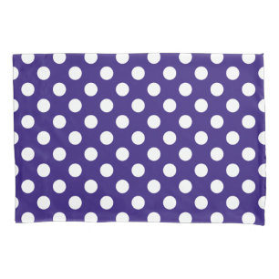 White polka dots on dark blue pillowcase